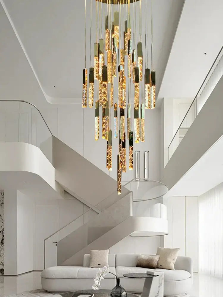 A modern gold-toned decorbites crystal ceiling pendant light with cascading cylindrical glass and geometric design