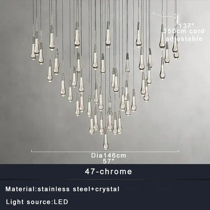 A modern decorbites crystal ceiling pendant light with 47 chrome teardrop crystals on stainless steel cords for dining room