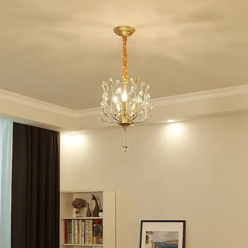 Gold-toned decorbites crystal chain pendant chandelier with crystal accents and twisted stem for indoor decor lighting