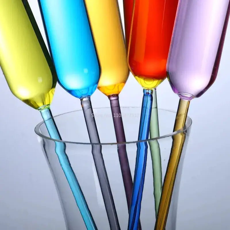 Colorful glass straws in yellow, blue, orange, red, and purple paired with decorbites crystal champagne wine glasses