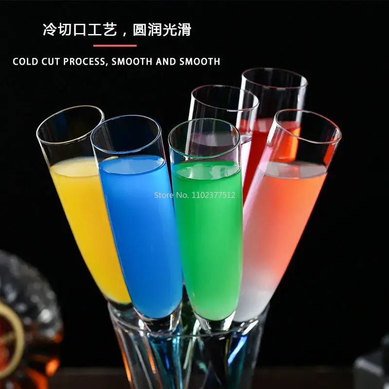 Set of five colorful decorbites crystal champagne wine glasses with smooth rims filled with vibrant liquids for parties