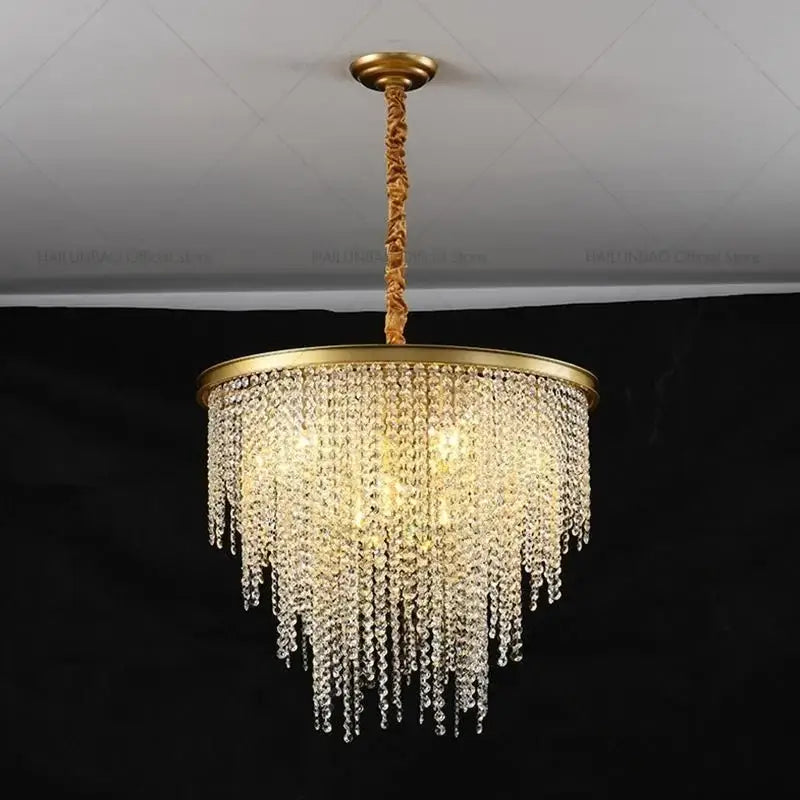 Gold-toned DecorBites crystal chandelier with cascading clear crystal beads and twisted rope pendant for modern living rooms
