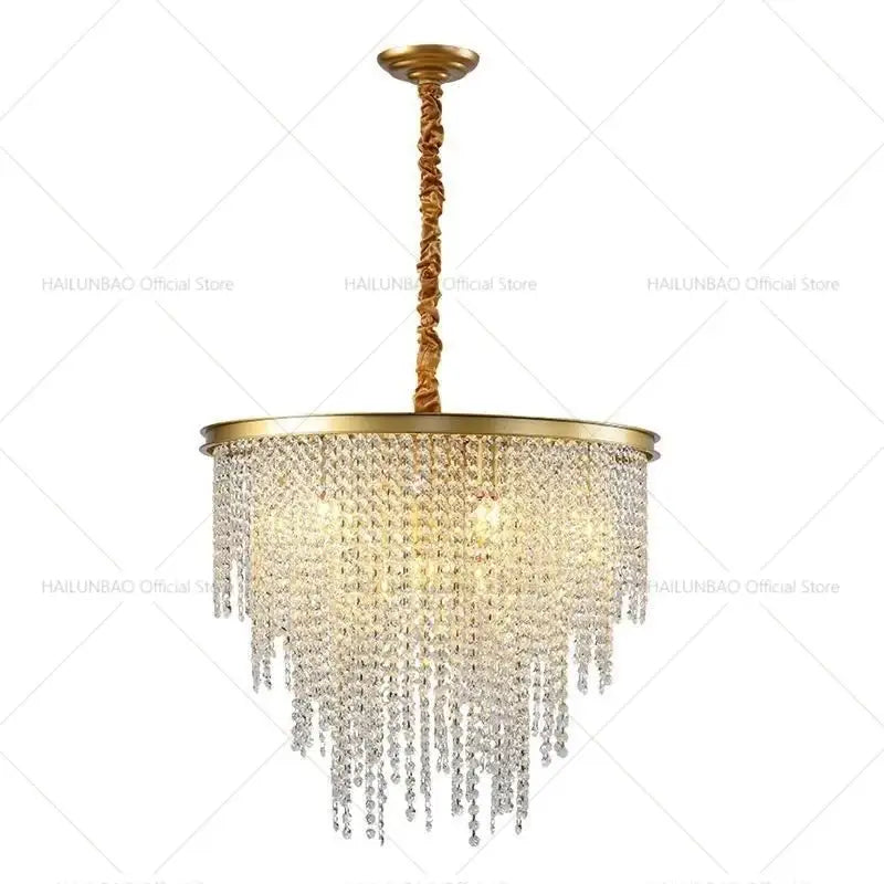 Gold-toned decorbites crystal chandelier with cascading clear crystal beads and twisted brass chain for living room lighting