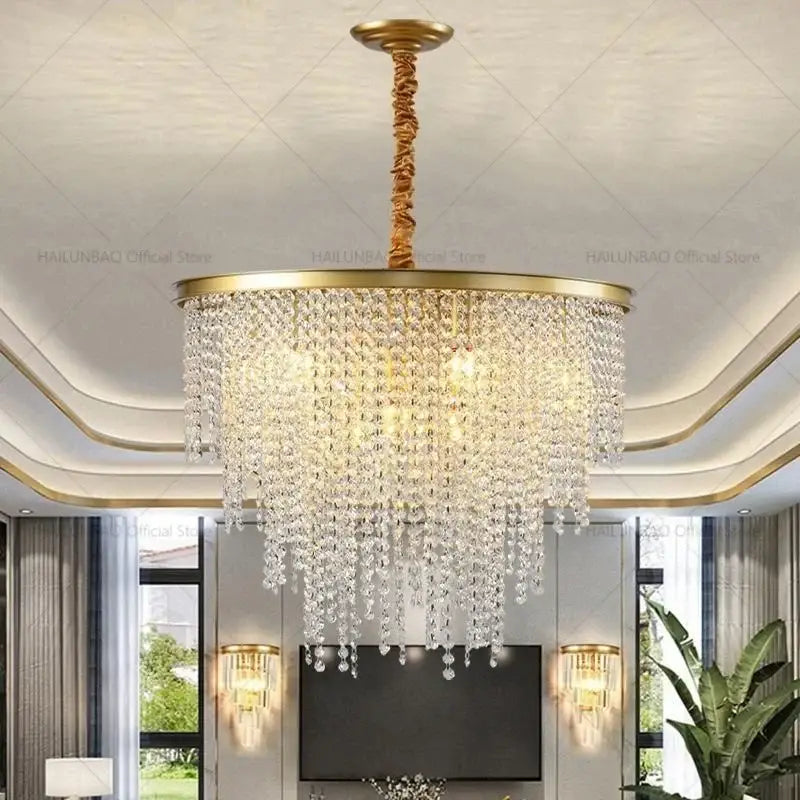 Gold-toned decorbites crystal chandelier with cascading clear crystal droplets for 2024 post-modern living room lighting
