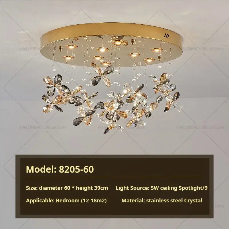 Gold-toned decorbites crystal chandelier with dangling clear and smoky crystal butterfly ornaments in stainless steel
