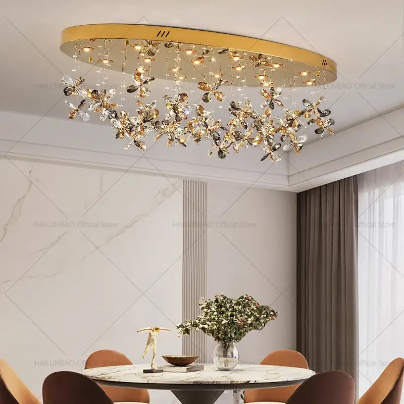 Gold-toned DecorBites crystal chandelier with dangling crystal butterfly ornaments for luxury dining or kitchen lighting