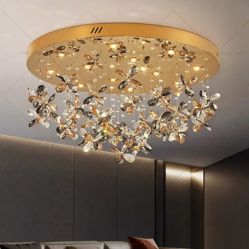 Gold-toned decorbites crystal chandelier with dangling crystal butterfly ornaments for postmodern luxury spaces