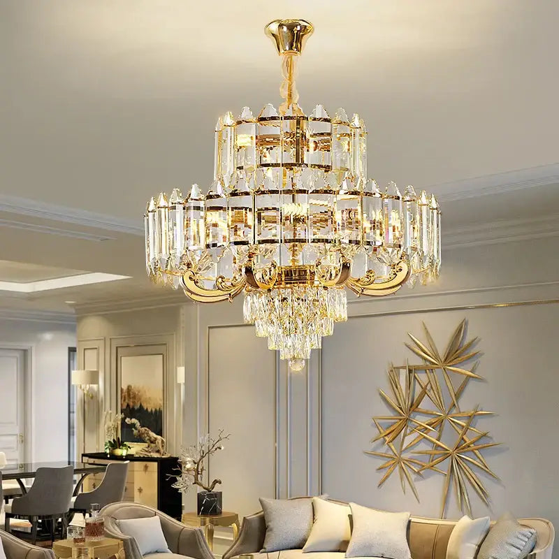 A luxurious gold-toned DecorBites crystal chandelier with clear crystal prisms for living room dining and bedroom