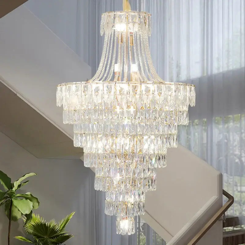 DecorBites crystal chandelier with cascading clear glass prisms and gold-toned accents for luxury living spaces