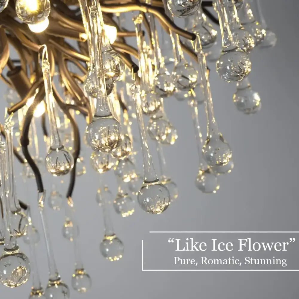 A gold-toned decorbites crystal chandelier with cascading clear glass teardrop pendants for living room and dining table