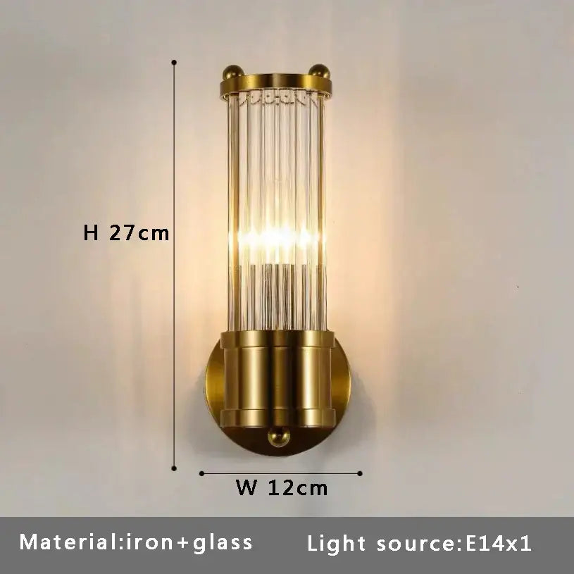 Gold-toned wall sconce with vertical glass rods and iron base complementing decorbites crystal chandelier ceiling fan