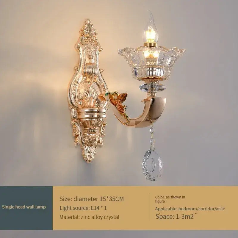 Gold-toned ornate decorbites crystal chandelier wall sconce with crystal accents and teardrop pendant for living and dining