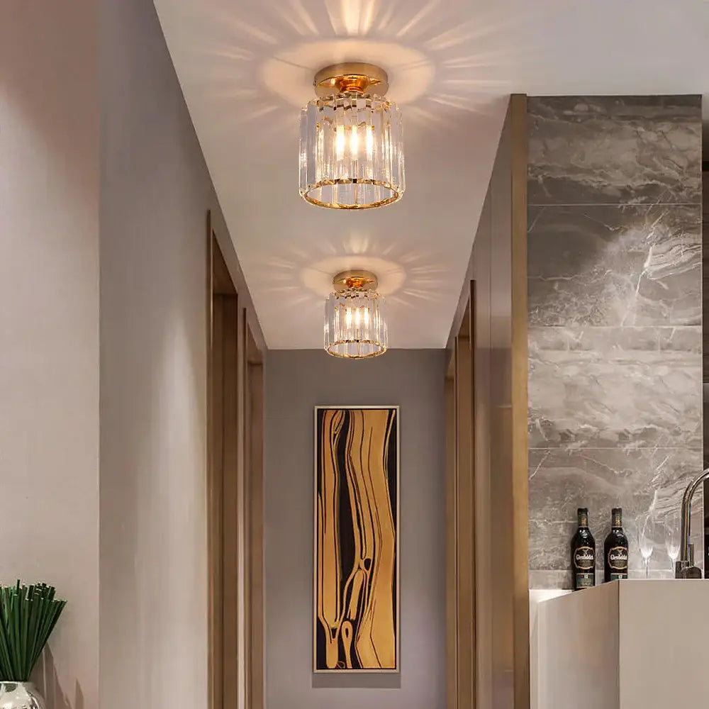 Gold-finished decorbites crystal chandelier ceiling light with cylindrical glass shade and multiple exposed bulbs
