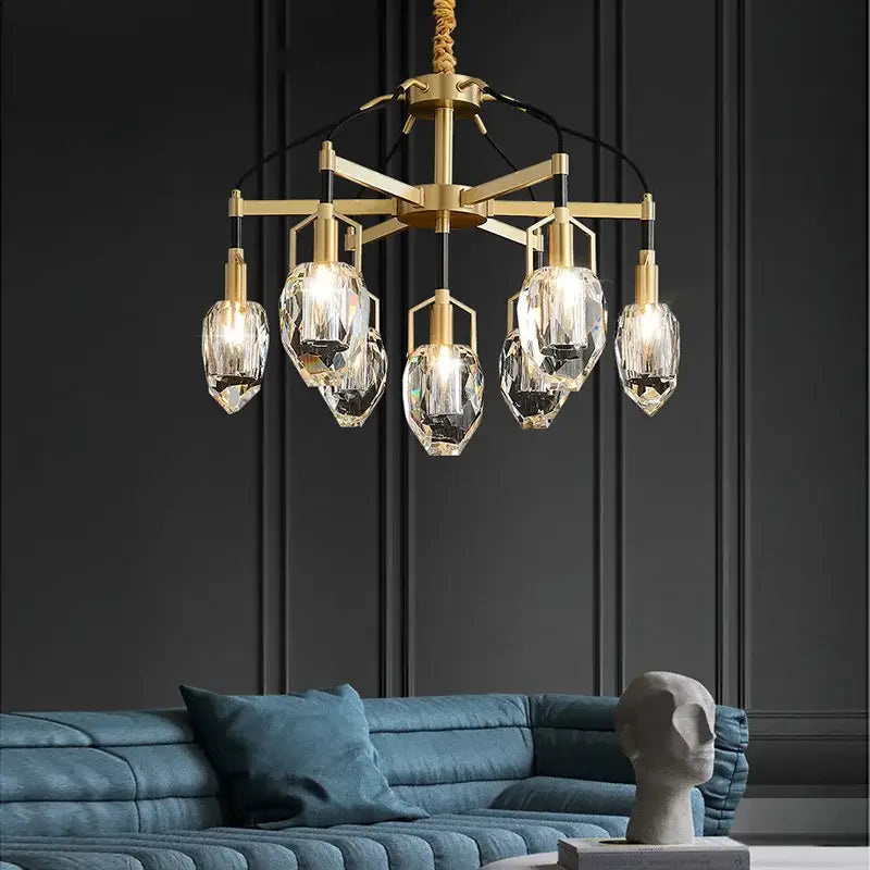 Gold-toned decorbites crystal chandelier ceiling light with five faceted crystal pendants on geometric metal frame
