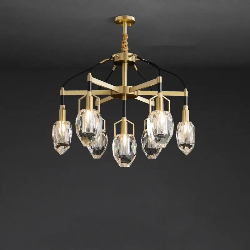 A decorbites crystal chandelier ceiling light with gold-toned metal frame and five faceted crystal glass shades