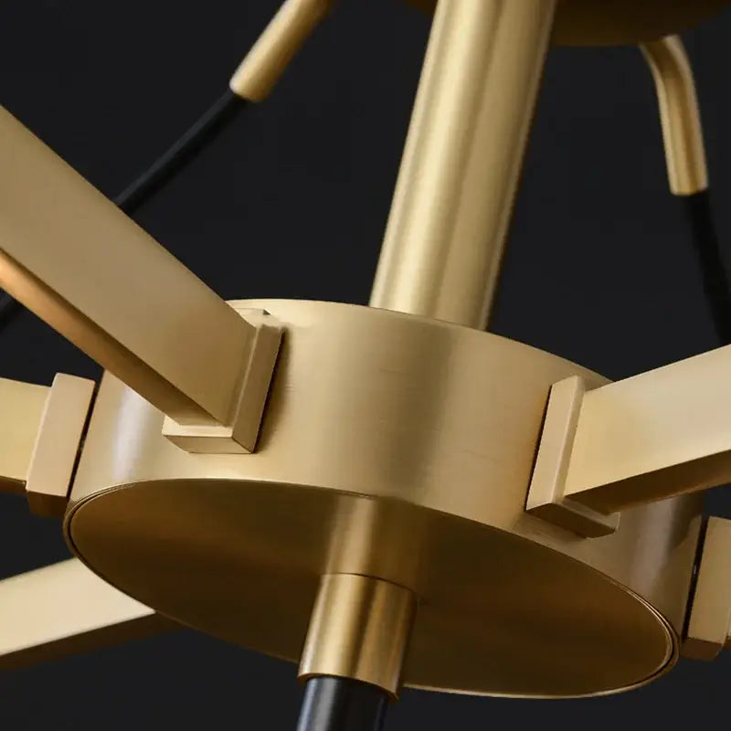 Brass-toned decorbites crystal chandelier with sleek geometric arms and modern industrial design for living room ceiling light