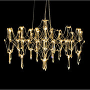 Gold-toned decorbites crystal chandelier pendant light with intricate crystal droplets and candle-style lights for home use