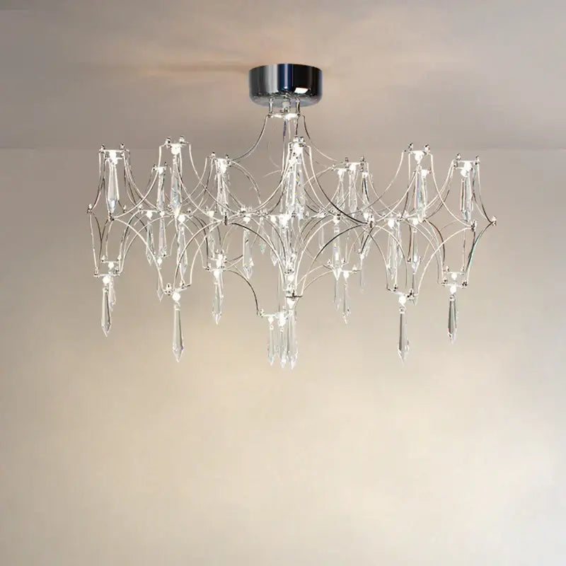 A modern chrome and crystal decorbites crystal chandelier pendant light with intricate branching design for home lighting