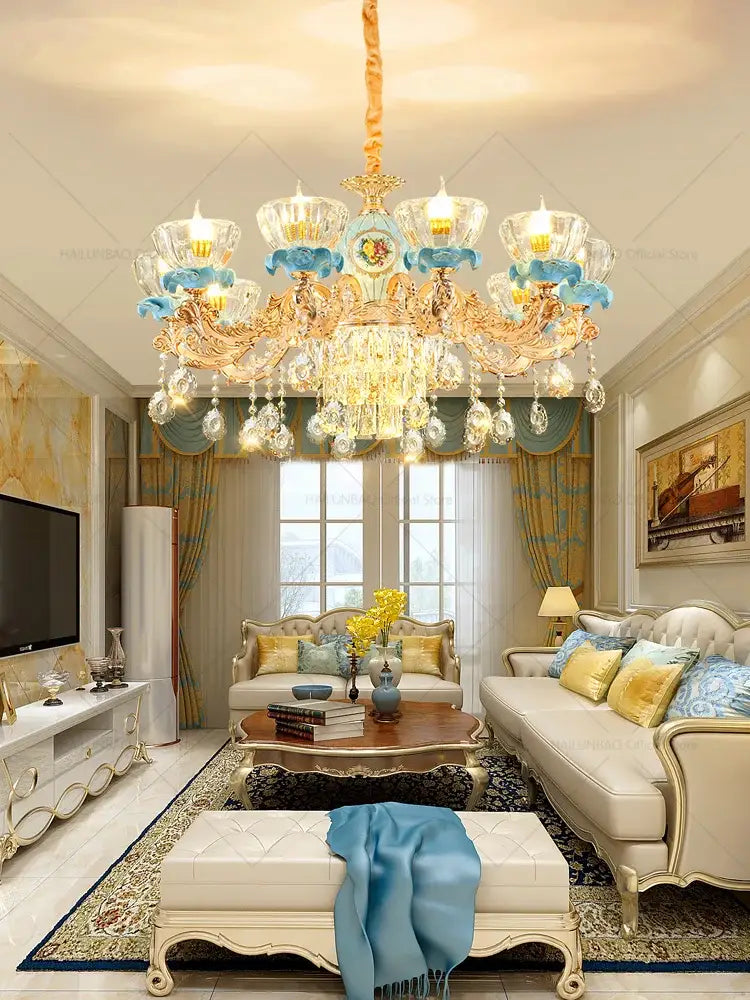 Decorbites crystal chandelier with gold metalwork, blue accents, and crystal droplets for luxe living room lighting