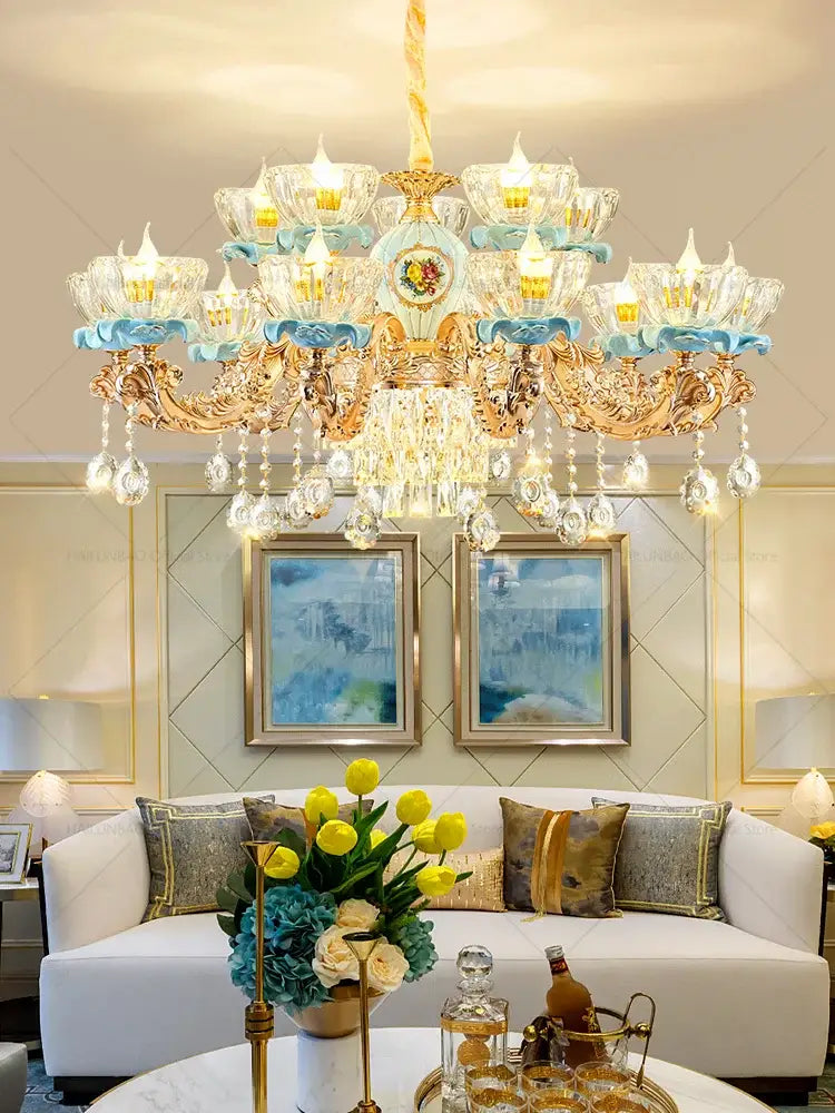 Gold-toned decorbites crystal chandelier with blue glass accents and dangling crystals for Chinese ceramic living room luxe lighting