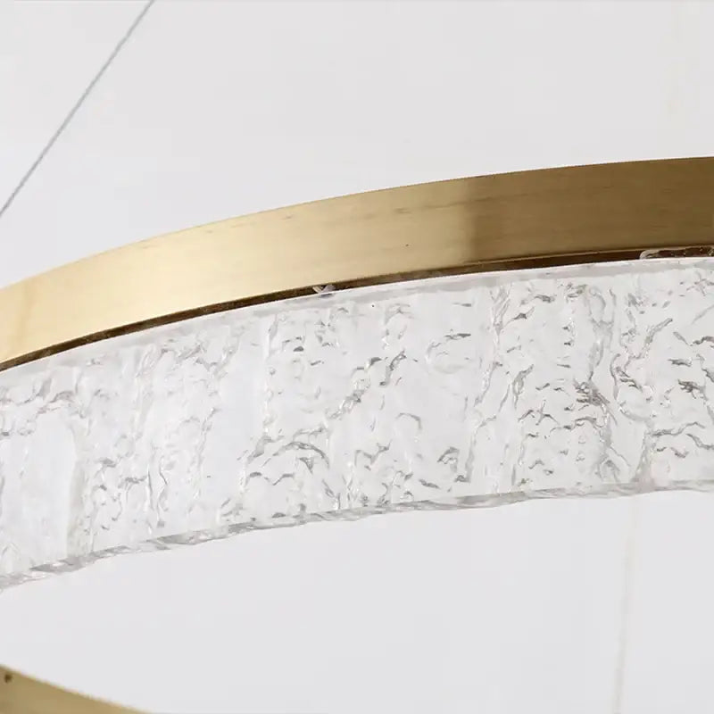 A decorbites crystal chandelier circular pendant light with textured clear glass and polished gold metal frame for dining table decor