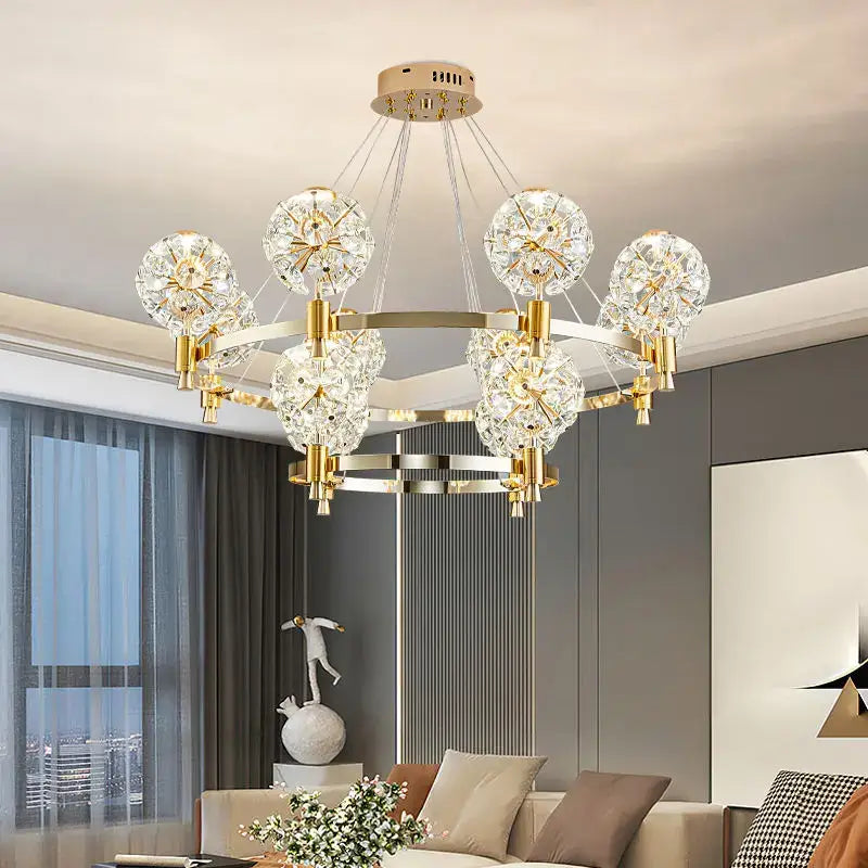 Gold-toned decorbites crystal chandelier with dandelion design and multiple crystal globes for luxe living spaces