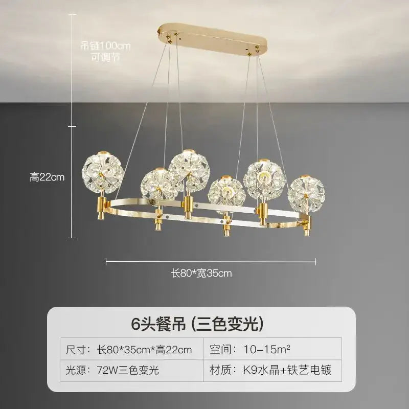 Gold-toned decorbites crystal chandelier with six crystal globe shades and sleek k9 crystal frame for luxe living spaces
