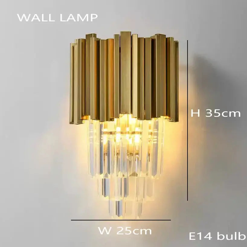 Gold-toned decorbites crystal chandelier wall lamp with vertical brass bars and cascading crystal prisms in stainless steel