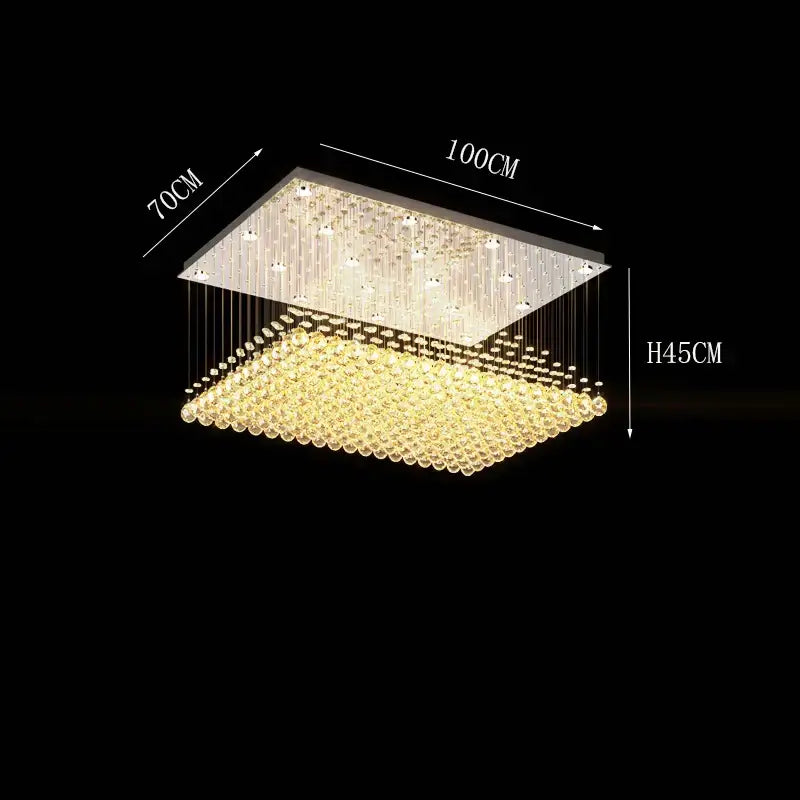 Rectangular decorbites crystal chandelier with cascading golden beads and clear crystals in a sleek metallic frame