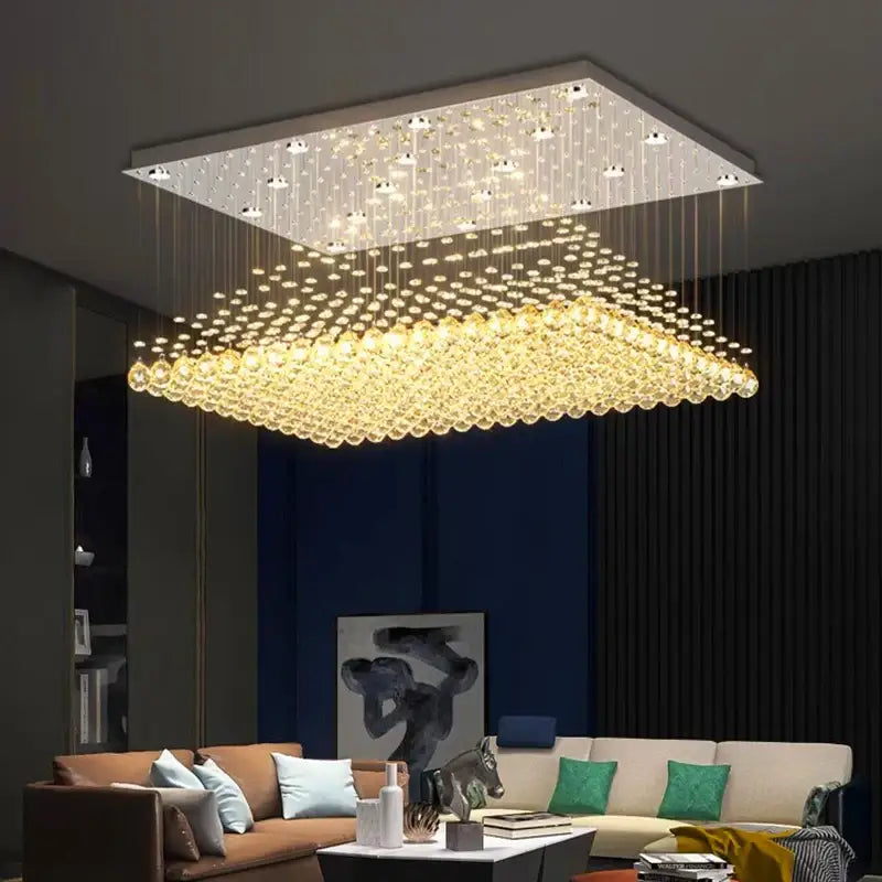 Square decorbites crystal chandelier with modern design featuring cascading golden beads and embedded led lights for dining room illumination