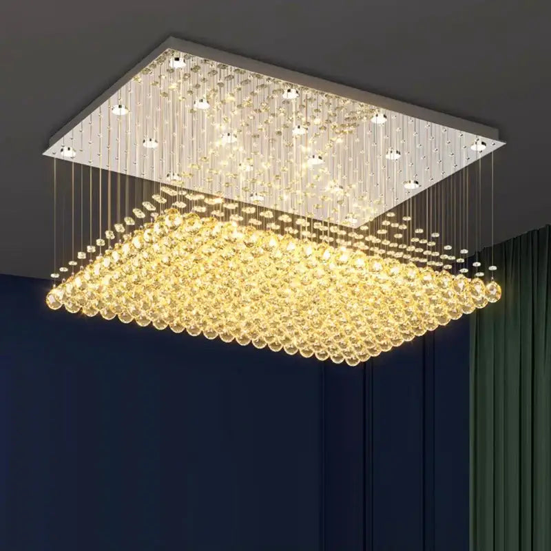 Decorbites crystal chandelier with cascading golden beads and sleek silver frame for indoor dining room lighting