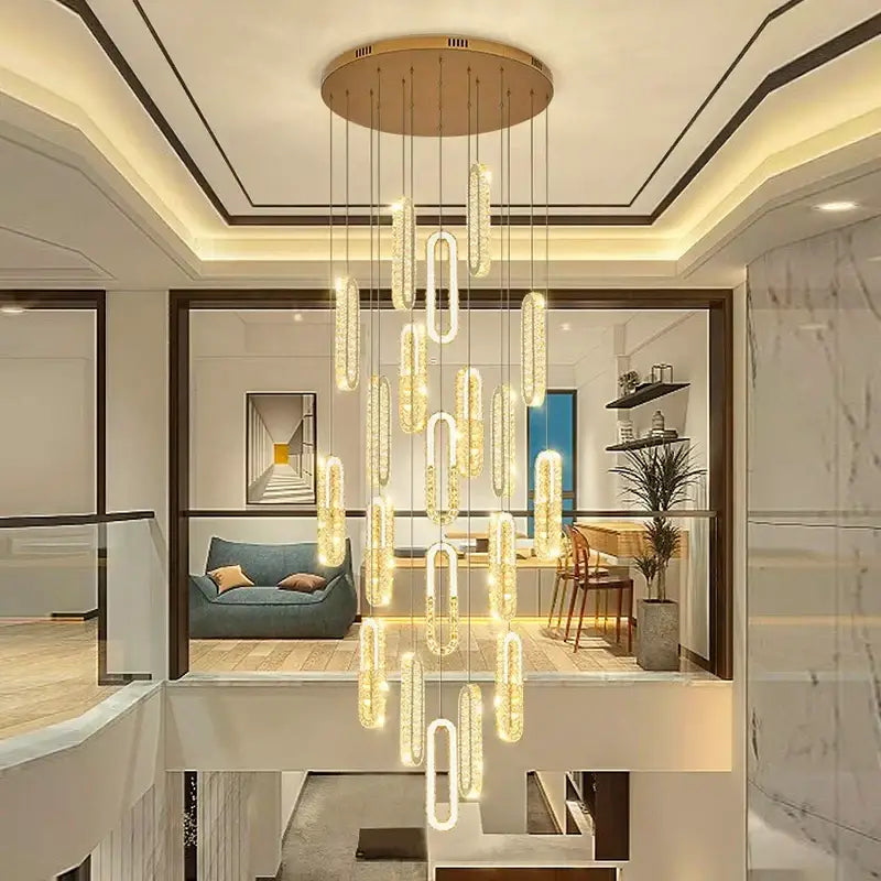 A decorbites crystal chandelier dining pendant light with gold ceiling mount and glowing cylindrical glass elements