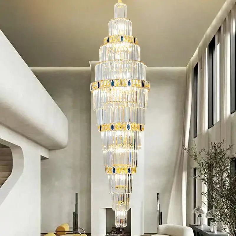 DecorBites crystal chandelier featuring a tall multi-tiered design with gold accents and blue gemstones for luxury lighting