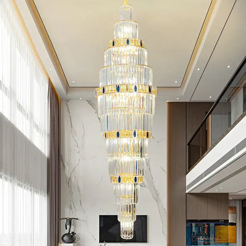 Decorbites crystal chandelier with multi-tiered crystal design, gold accents, and blue gemstone details for luxury lighting