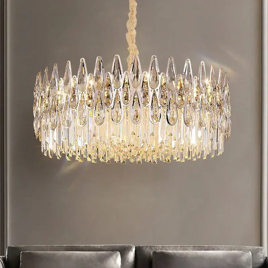 Decorbites crystal chandelier with clear teardrop prisms and faceted crystals refracting warm light for luxury decor