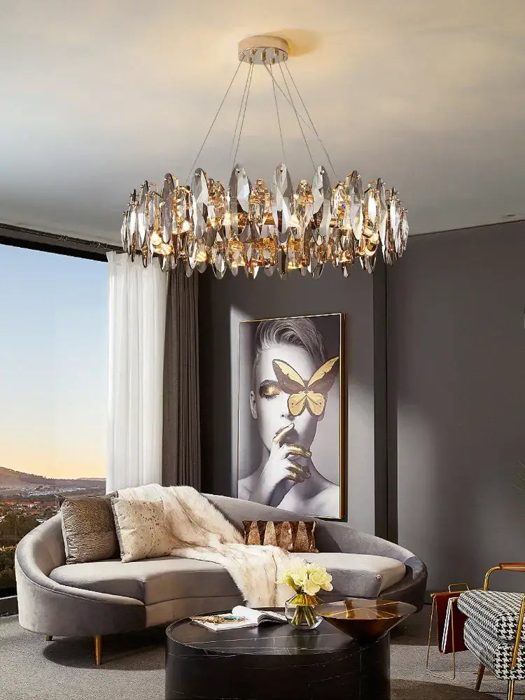 A modern decorbites crystal chandelier with cascading crystal and gold-toned accents for living room and dining table