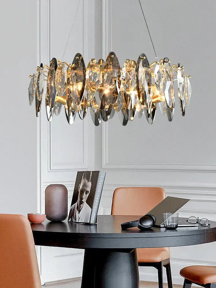 A decorbites crystal chandelier with circular design featuring gold and clear faceted crystals for living room and dining table