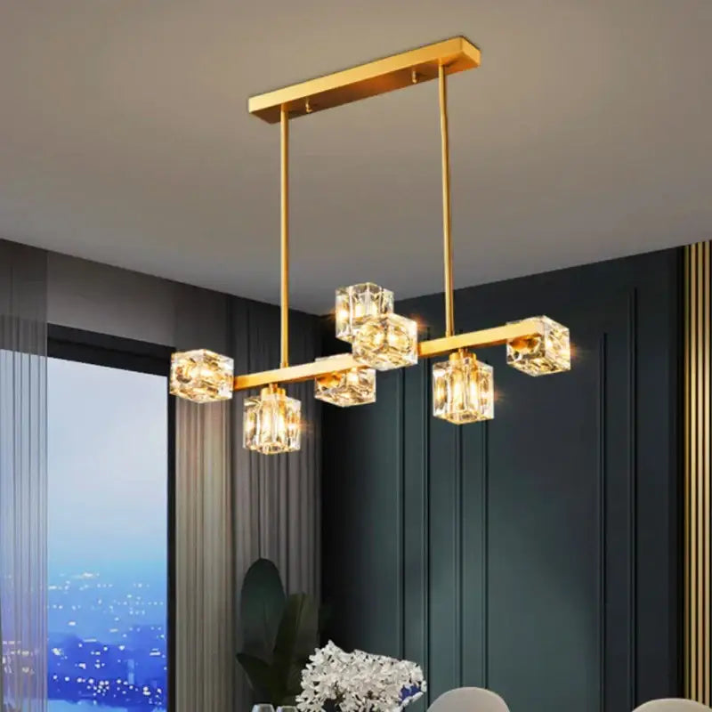 Gold-toned decorbites crystal chandelier with clear faceted crystal cube lights for elegant living and dining rooms
