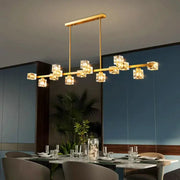 Gold-toned decorbites crystal chandelier with clear crystal cube lights on a sleek bar for living and dining rooms