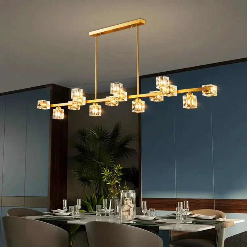 Gold-toned decorbites crystal chandelier with clear crystal cube lights on a sleek bar for living and dining rooms
