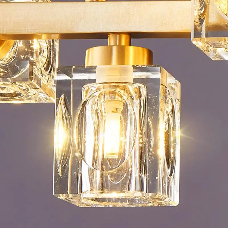 Decorbites crystal chandelier with clear faceted glass cubes and golden brass frame for living and dining rooms