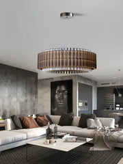 A modern decorbites crystal chandelier with metallic frame and copper-toned glass rods for living room decor