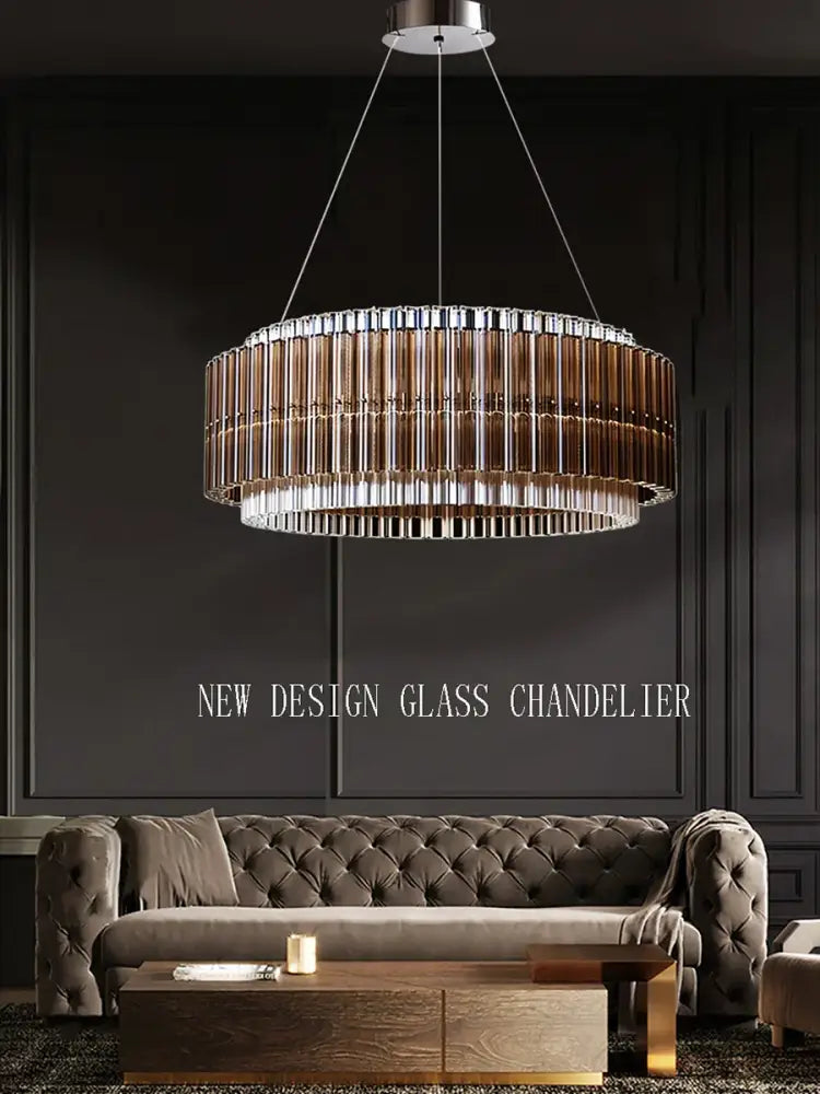 A decorbites crystal chandelier featuring two-tiered amber and clear cylindrical crystal rods in a chrome fixture