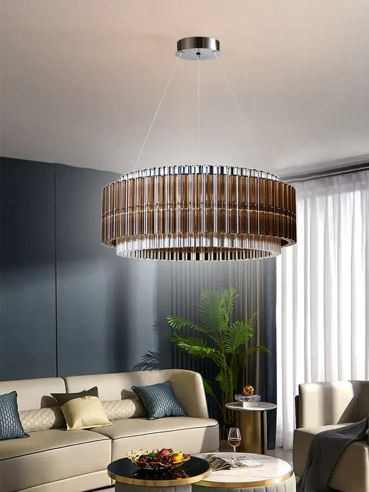 A modern decorbites crystal chandelier with metallic bronze and clear crystal design for living room and dining décor
