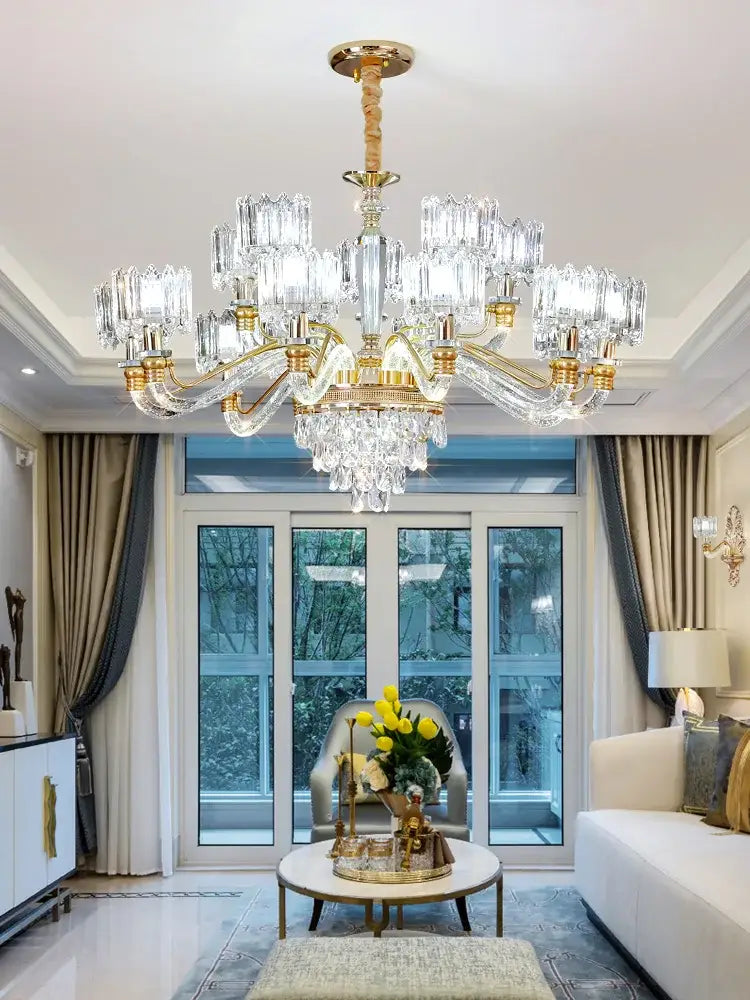 A luxurious gold-toned decorbites crystal chandelier with multiple crystal arms for elegant living room decor