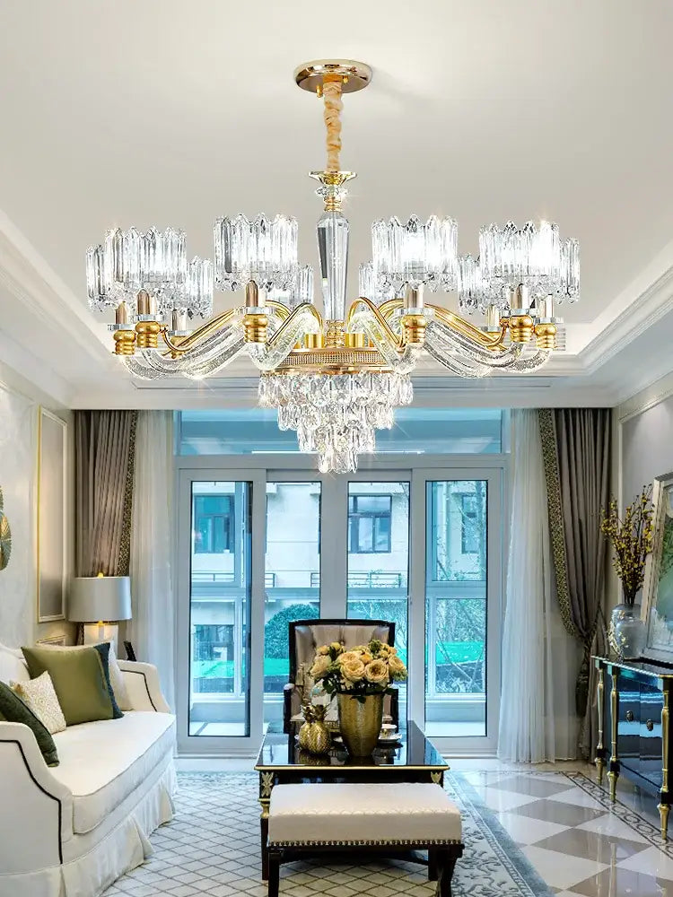 A luxurious gold-toned decorbites crystal chandelier with crystal prisms for elegant living room or bedroom lighting
