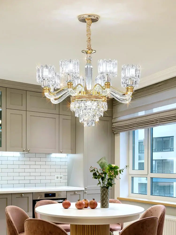 Luxurious decorbites crystal chandelier with gold-toned metal and faceted glass shades for elegant living spaces