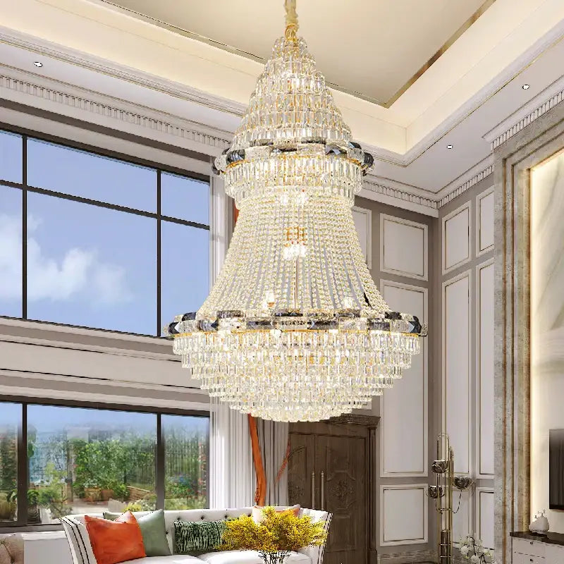 A decorbites crystal chandelier with multi-tiered clear and dark-cut crystals and gold accents for elegant luxury lighting