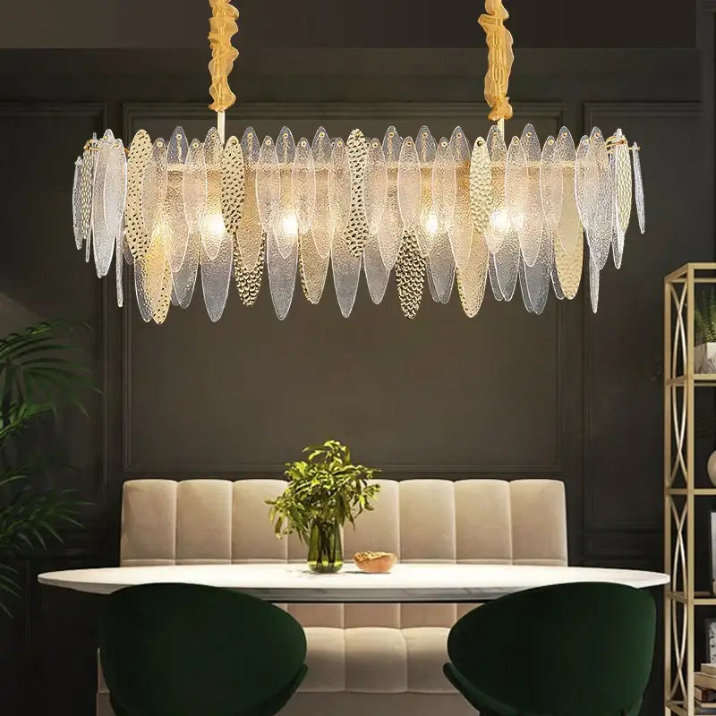 Elegant gold-toned decorbites crystal chandelier with cascading translucent leaf-shaped glass panels in european style