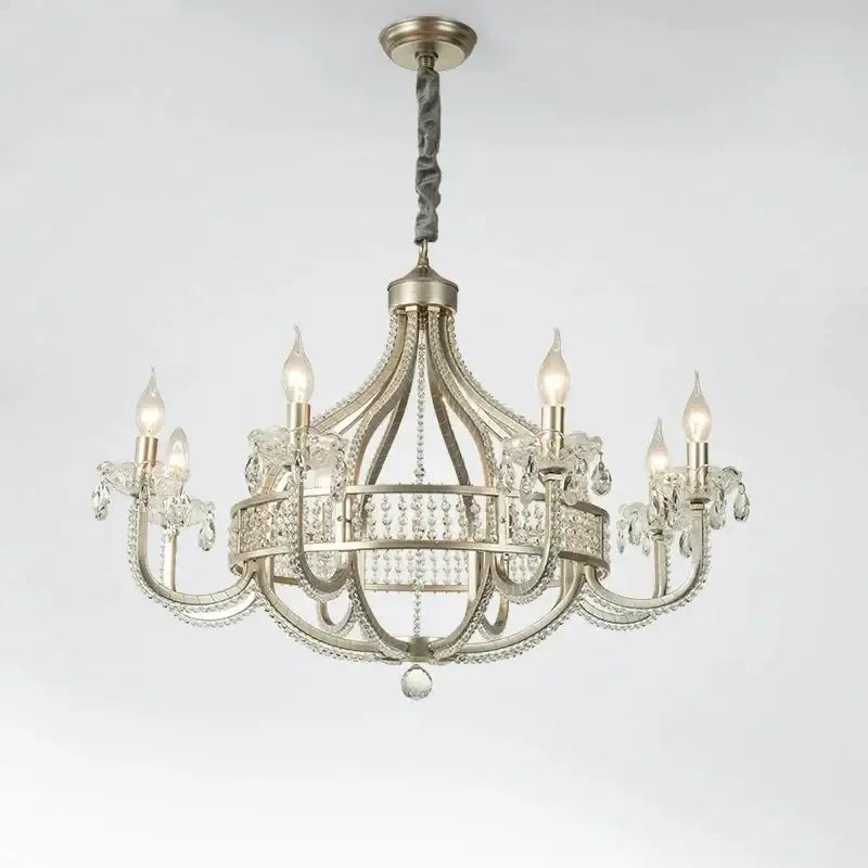 Antique silver decorbites crystal chandelier with crystal accents and six candle-style lights for elegant interiors